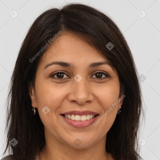 Joyful white adult female with long  brown hair and brown eyes