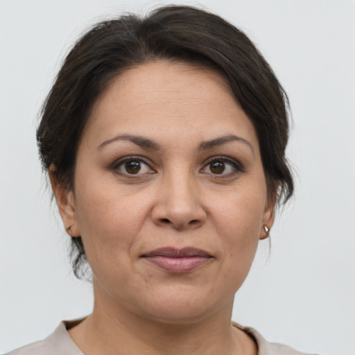 Joyful white adult female with medium  brown hair and brown eyes