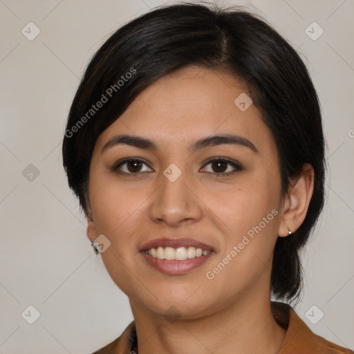 Joyful latino young-adult female with medium  brown hair and brown eyes