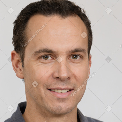 Joyful white adult male with short  brown hair and brown eyes