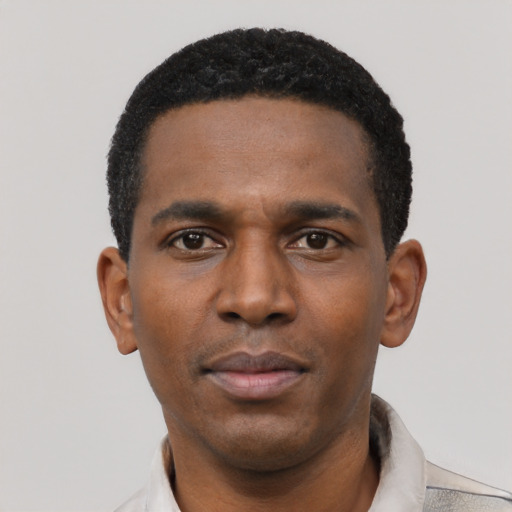 Neutral black young-adult male with short  black hair and brown eyes