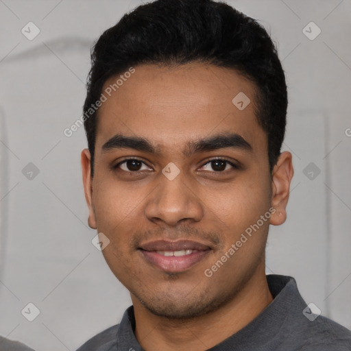 Joyful latino young-adult male with short  black hair and brown eyes