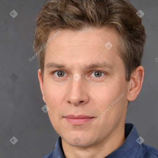 Joyful white adult male with short  brown hair and grey eyes