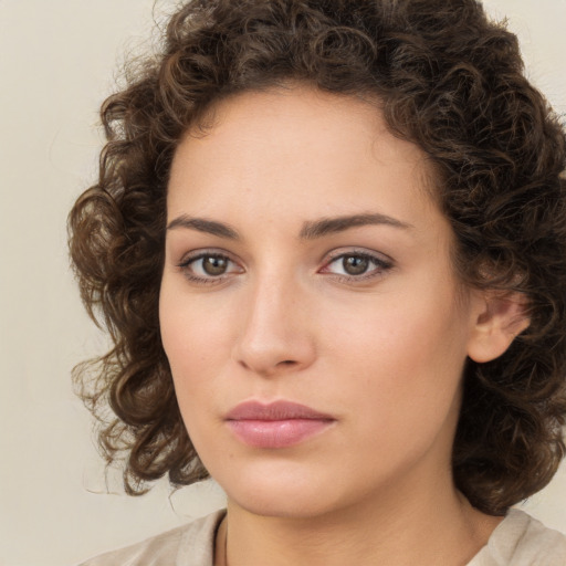 Neutral white young-adult female with medium  brown hair and brown eyes