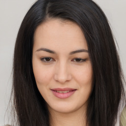 Joyful asian young-adult female with long  brown hair and brown eyes