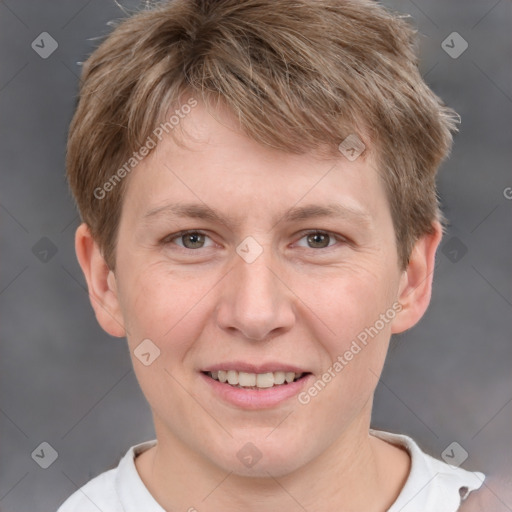 Joyful white adult male with short  brown hair and grey eyes