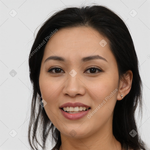 Joyful asian young-adult female with long  brown hair and brown eyes