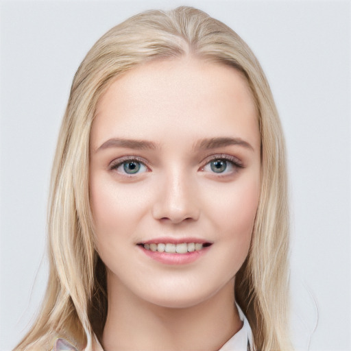 Joyful white young-adult female with medium  brown hair and blue eyes