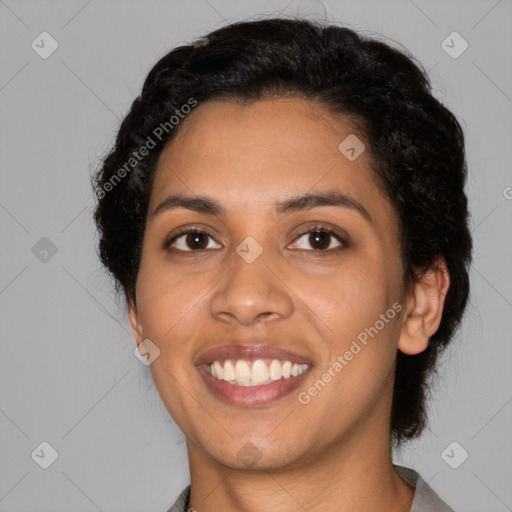 Joyful latino young-adult female with short  black hair and brown eyes