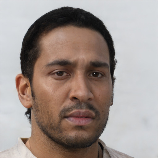 Neutral black young-adult male with short  black hair and brown eyes