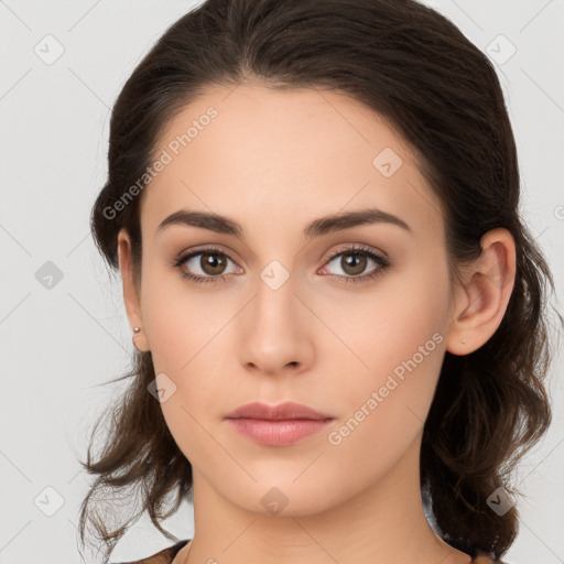 Neutral white young-adult female with long  brown hair and brown eyes