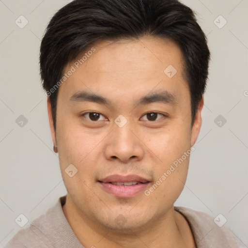 Joyful asian young-adult male with short  brown hair and brown eyes