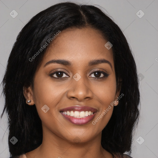 Joyful black young-adult female with long  brown hair and brown eyes