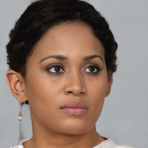 Neutral latino young-adult female with short  brown hair and brown eyes