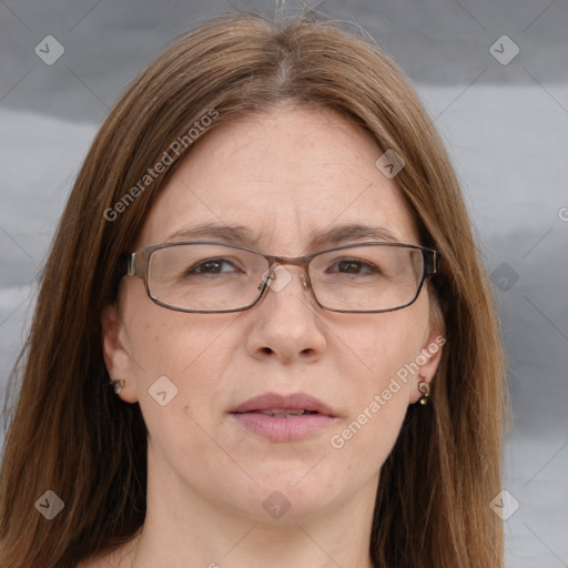 Joyful white adult female with medium  brown hair and blue eyes