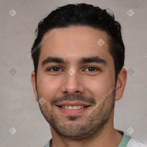 Joyful white young-adult male with short  black hair and brown eyes