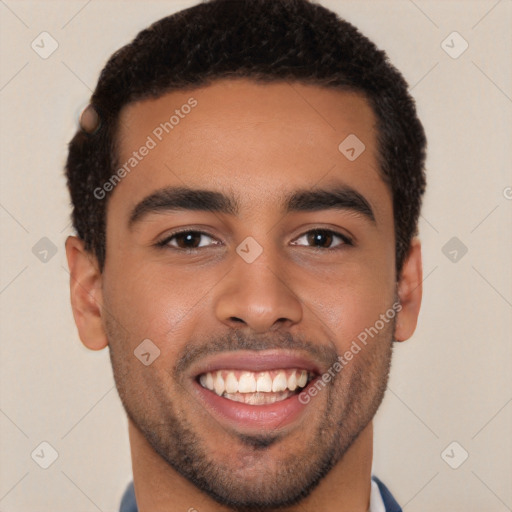 Joyful latino young-adult male with short  brown hair and brown eyes