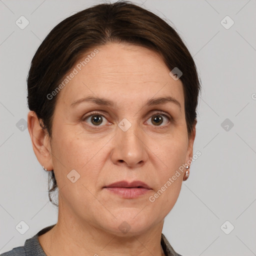 Joyful white adult female with short  brown hair and grey eyes