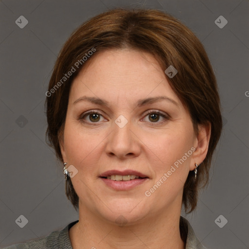 Joyful white adult female with medium  brown hair and grey eyes