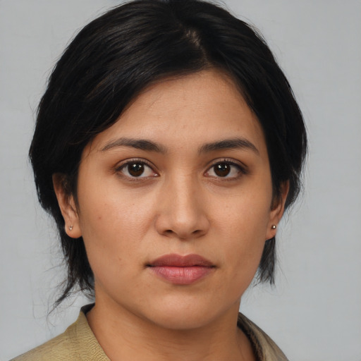 Joyful asian young-adult female with medium  black hair and brown eyes