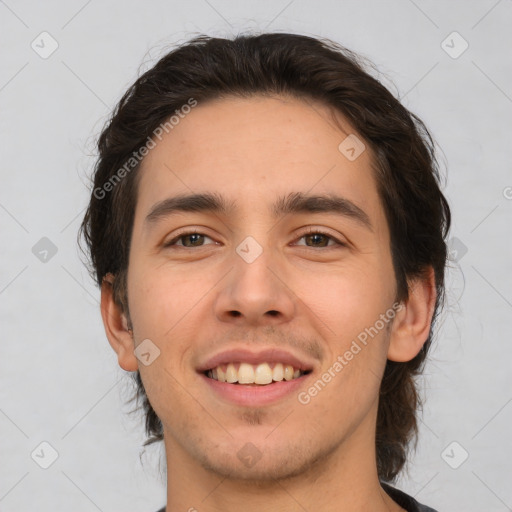 Joyful white young-adult male with medium  brown hair and brown eyes