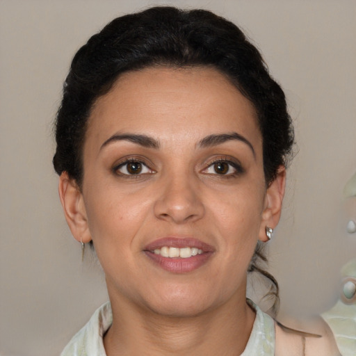 Joyful latino young-adult female with short  brown hair and brown eyes