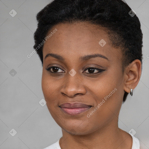 Joyful black young-adult female with short  brown hair and brown eyes