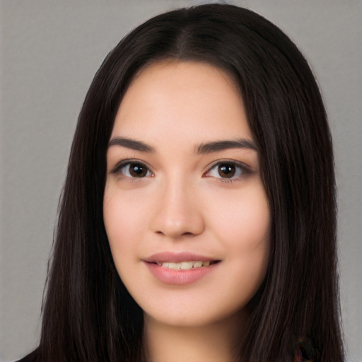 Joyful white young-adult female with long  black hair and brown eyes