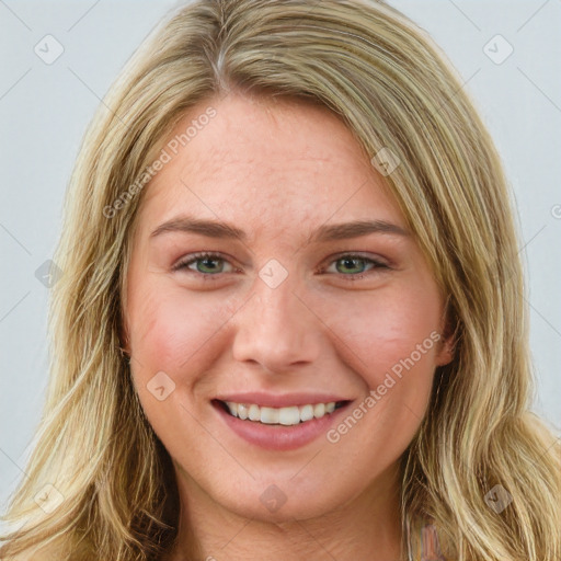 Joyful white young-adult female with long  brown hair and blue eyes