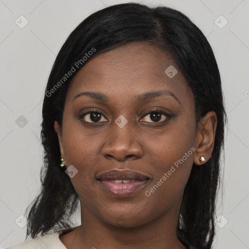 Joyful black young-adult female with long  black hair and brown eyes