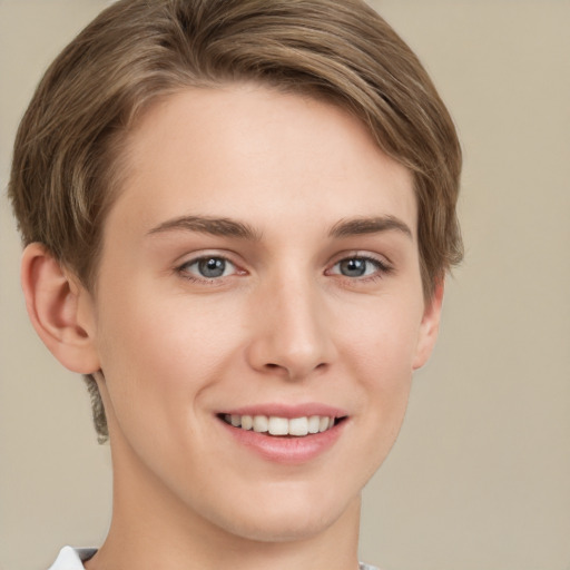 Joyful white young-adult female with short  brown hair and grey eyes