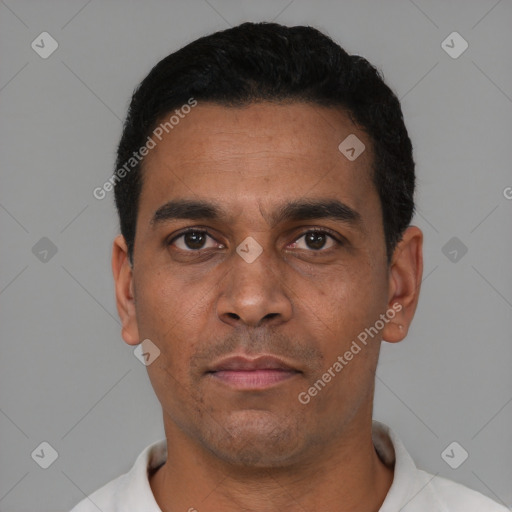 Neutral latino adult male with short  black hair and brown eyes