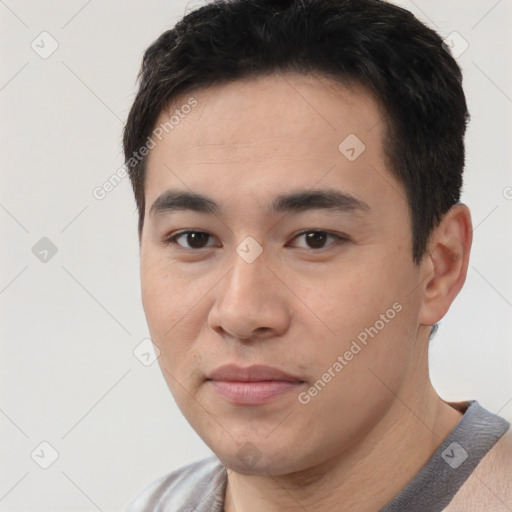 Joyful white young-adult male with short  black hair and brown eyes