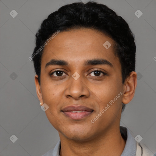 Joyful latino young-adult male with short  black hair and brown eyes