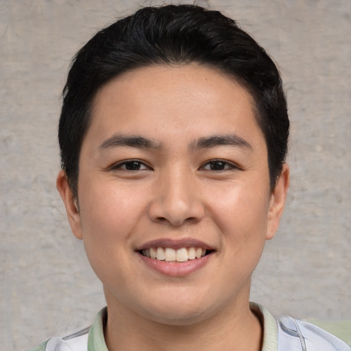 Joyful white young-adult male with short  black hair and brown eyes