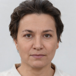 Joyful white adult female with short  brown hair and brown eyes