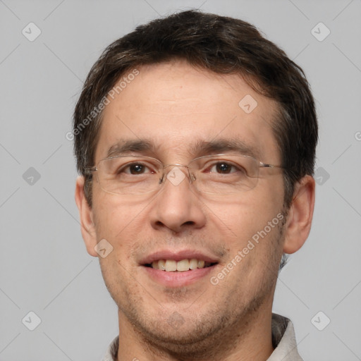 Joyful white adult male with short  brown hair and brown eyes