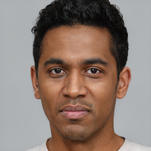 Neutral black young-adult male with short  black hair and brown eyes