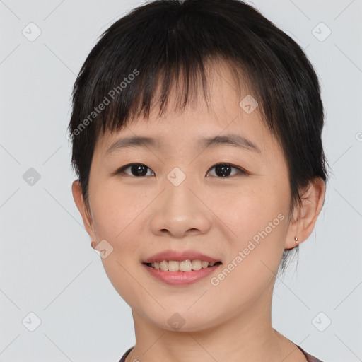 Joyful asian young-adult female with short  brown hair and brown eyes