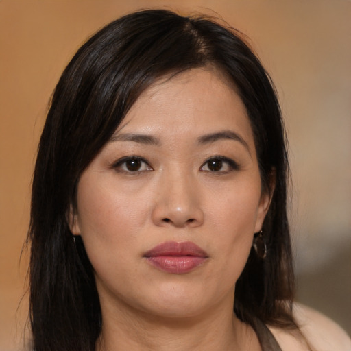 Neutral asian young-adult female with medium  brown hair and brown eyes