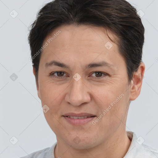 Joyful white adult female with short  brown hair and brown eyes