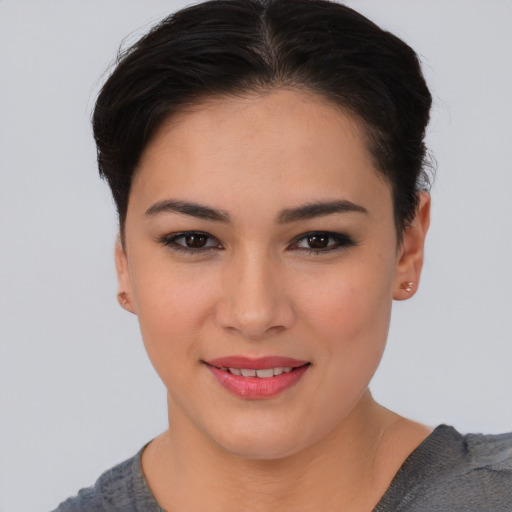 Joyful asian young-adult female with short  brown hair and brown eyes