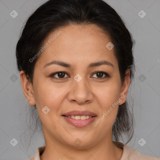 Joyful latino adult female with medium  brown hair and brown eyes