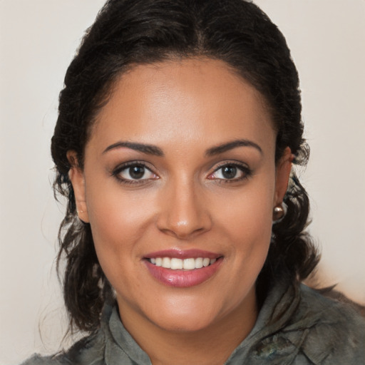 Joyful white young-adult female with long  brown hair and brown eyes