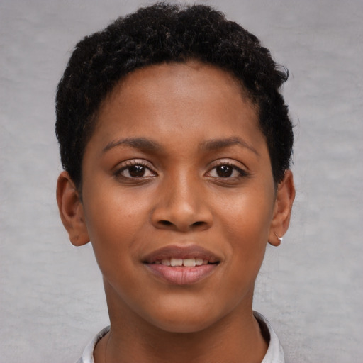 Joyful black young-adult female with short  brown hair and brown eyes