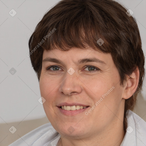 Joyful white adult female with short  brown hair and brown eyes