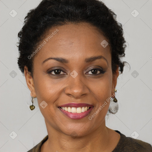 Joyful black adult female with short  brown hair and brown eyes