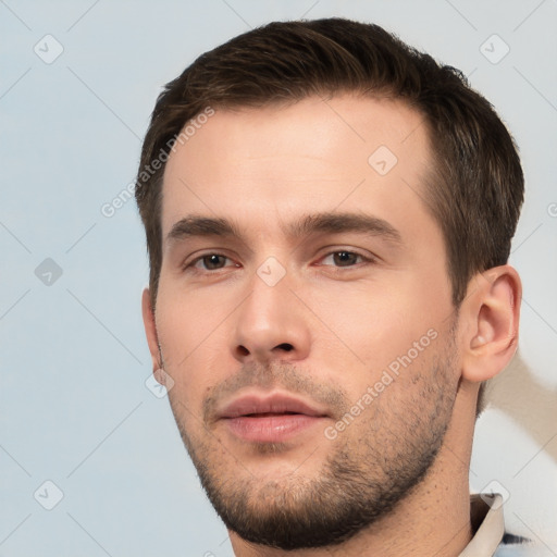 Neutral white young-adult male with short  brown hair and brown eyes