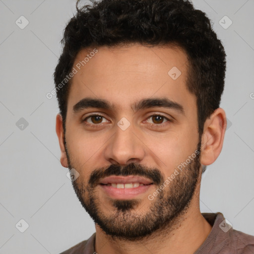 Joyful white young-adult male with short  black hair and brown eyes