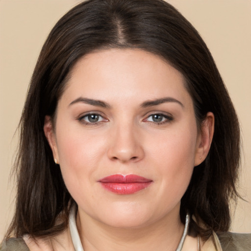 Joyful white young-adult female with medium  brown hair and brown eyes